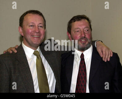 Home Secretary David Blunkett (right) meets with his police serving cousin, a PC also named David Blunkett after delivering his speech at the Police Federation Conference in Bournemouth. Stock Photo