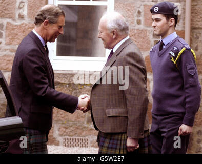 The Prince of Wales is greeted by Lord Lieutenant Angus Farquarson and Cadet Warrant Officer Jamie Duff on a tour of Alastrean House in Aberdeenshire, the care home operated by the Royal Air Force for former members which accommodates up to 58 residents. Stock Photo