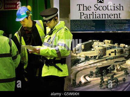 Police look at the papers of builders working on the Scottish parliament site during a raid to find illegal workers in Edinburgh. A joint operation between Lothian and Borders Police and the Department of Work and Pensions (DWP) was launched after a tip off. *...Now an investigation is under way to establish whether any workers have been falsely claiming benefits while employed at the site of the, 260 million building, under construction at Holyrood in Edinburgh. Stock Photo