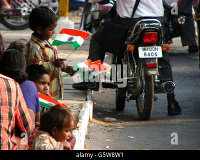 Poor children selling flags on the eve of Independence day in India Stock Photo