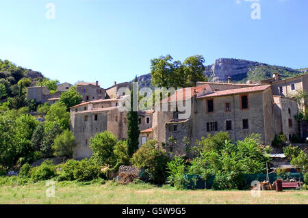 Circus and Navacelles village located in the mountains of the Cevennes in south-eastern France. Stock Photo