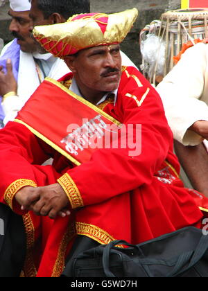 Man in traditional Indian attire with red turban Stock Photo - Alamy