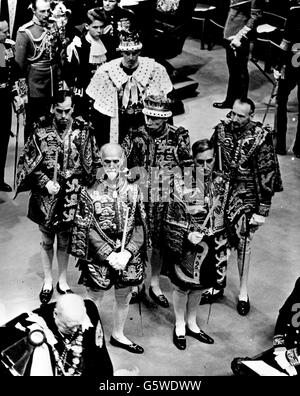 The Duke of Edinburgh proceeded by the heralds leaving Westminster Abbey. At the front very bottom left of the picture is Winston Churchill. Stock Photo
