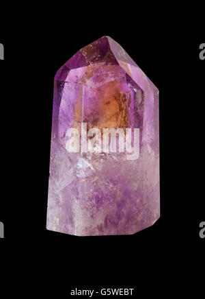 Crystal of natural gemstone amethyst. Isolated on the black background. Stock Photo