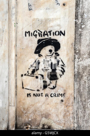 Street art social comment on migration in the Psyrri district of central Athens, Greece Stock Photo