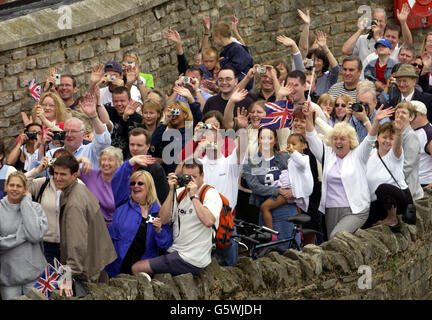 Crowds wave back to Queen Elizabeth II as she crosses the Windsor to Eton Bridge, during her Golden Jubilee bank holiday events. It is believed that 16,000 people were in attendance to see the Queen at Windsor for the 50th anniversary of her reign. Stock Photo