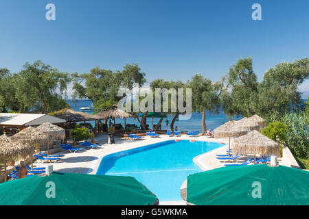 Paxos - people relaxing at the free swimming pool at Bastas Taverna Manadendri Monodendri beach, Greece, Europe and paddle board Stock Photo