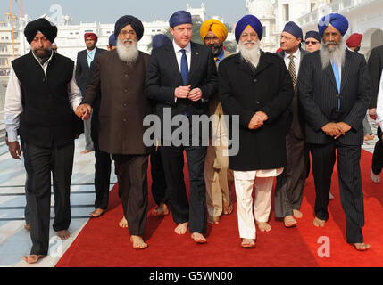 Prime Minister David Cameron is shown around the Golden Temple at Amritsar in Punjab, India, during the last day of a three day visit to the country.