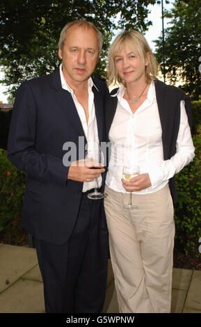 Mark Knopfler with wife Kitty and daughter Isabella arriving for the UK premiere of African Cats