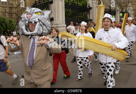Members of ActionAid, who have applied for a patent for British style chips to highlight patenting laws which allow companies to profit from patenting basic food crops, * ... dressed as a 'fat cat' and 'chefs with chips' join a mass lobby in London asking Parliament to change international trade laws in aid of developing countries. Trade Justice Movement a new grouping of charities, aid agencies and campaign groups wants the rules on international trade rewritten to favour the world's poorest communities and safeguard the environment. Organisers said the Movement's creation was sparked in Stock Photo