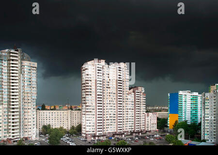 Urban landscape with black stormy clouds in th sky Stock Photo