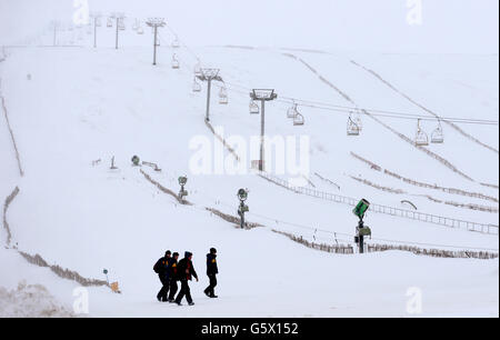 People walk past the the ski lift where an accident occurred further up the hill at the Lecht ski centre near Tomintoul. Stock Photo