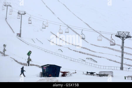 People walk past the the ski lift where an accident occurred further up the hill at the Lecht ski centre near Tomintoul. Stock Photo