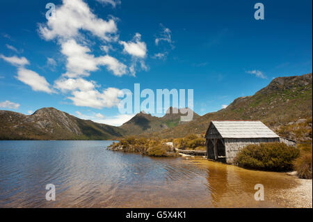 A boathouse sits on the edge of Dove Lake with Cradle Mountain in the background.  Tasmania, Australia. Stock Photo