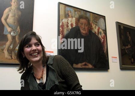Artist Catherine Goodman stands in front of her winning portrait entitled 'Antony', after she picked up the first prize at the BP Portrait Awards at the National Portrait Gallery in London. Goodman picked up 25,000 for a painting of her friend Antony Sutch. *..., who is headmaster of Downside School in Somerset. Stock Photo