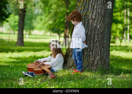 cute children playing guitar Stock Photo