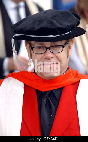 Sir Elton John smiles after receiving an Honorary Doctorate from the Royal Academy of Music outside the Royal Academy of Music in London. * Sir Elton who studied at the Academy was accompanied by his partner David Furnish and his parents mother Sheila and stepfather Fred Fairbrother. Stock Photo