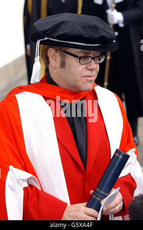 Sir Elton John smiles after receiving an Honorary Doctorate from the Royal Academy of Music outside the Royal Academy of Music in London. * Sir Elton who studied at the Academy was accompanied by his partner David Furnish and his parents mother Sheila and stepfather Fred Fairbrother. Stock Photo