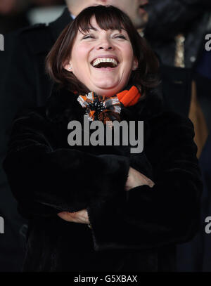 TV presenter Lorraine Kelly smiles as she sits in the stands during the Scottish Cup, Sixth Round at Dens Park, Dundee. Stock Photo