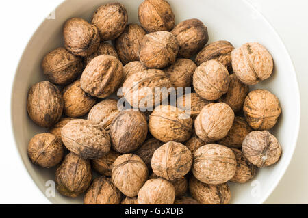 Walnuts in shell on a white background Stock Photo