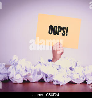 HAND HOLDING YELLOW PAPER WITH OOPS!CONCEPT Stock Photo