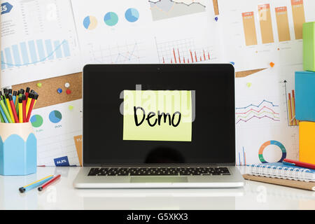 DEMO sticky note pasted on the laptop screen Stock Photo