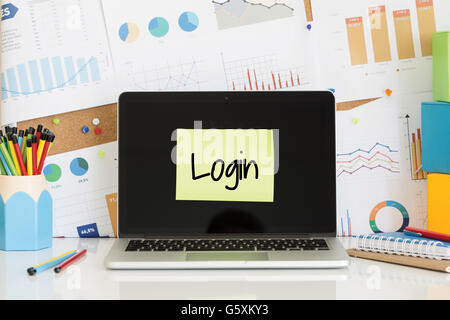 LOGIN sticky note pasted on the laptop screen Stock Photo