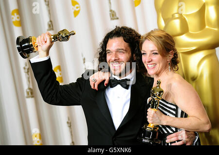 Sean Fine and Andrea Nix Fine with their Oscars for best documentary short subject received for Inocente during the 85th Academy Awards at the Dolby Theatre, Los Angeles. PRESS ASSOCIATION Photo. Picture date: Sunday February 24, 2013. See PA story SHOWBIZ Oscars. Photo credit should read: Ian West/PA Wire Stock Photo