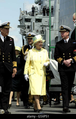 Queen Elizabeth II walks on the deck of the aircraft carrier HMS Ark Royal, during a visit to Portsmouth. The Queen and Duke of Edinburgh spent a day with the Armed Forces on an occasion described as the biggest Jubilee event outside London. * that had begun with an RAF flypast with aircraft in the formation of the 'EIIR' cypher. Stock Photo