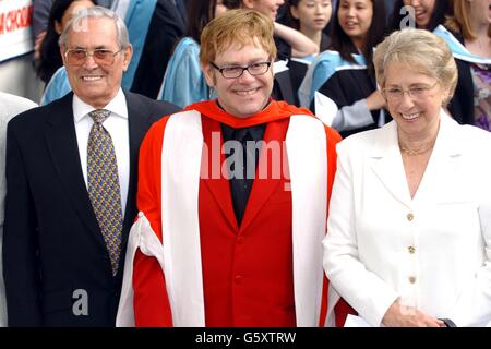 Sir Elton John smiles with his mother Sheila and stepfather Fred Fairbrother after receiving an Honorary Doctorate from the Royal Academy of Music outside the Royal Academy of Music in London. * Sir Elton who studied at the Academy was accompanied by his partner David Furnish and his parents. Stock Photo