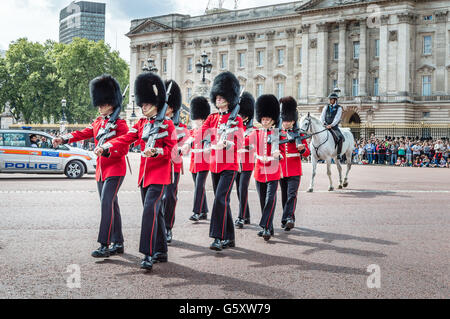 London, UK - August 19, 2015: Royal Guards parade during traditional Changing of the Guards ceremony near Buckingham Palace. Stock Photo