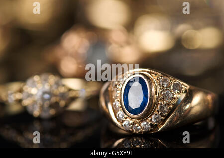 Gold jewelry on a black background. Stock Photo