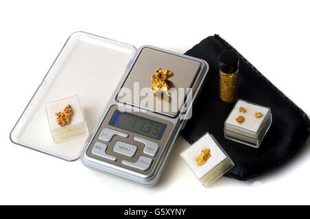 precision scales for weighing gold coins or useful nugget for the purchase and sale of the precious metal Stock Photo