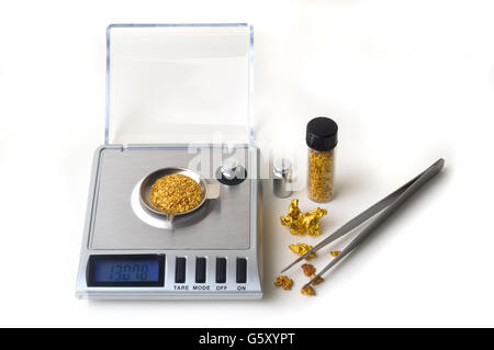 precision scales for weighing gold coins or useful nugget for the purchase and sale of the precious metal Stock Photo