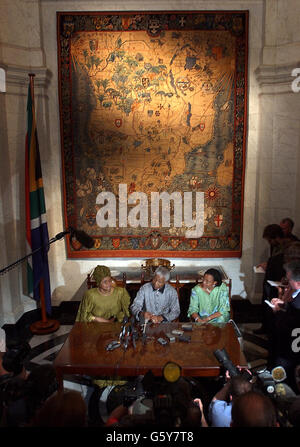 Former South African president Nelson Mandela (centre) speaks to the media during a press conference at South Africa House in London after he met relatives of the victims of the Lockerbie bombing. *Mr Mandela, who last month visited the man convicted of smuggling a bomb aboard the Pan Am jet which exploded over Lockerbie with the loss of 270 lives in 1988, met more than 30 relatives in London. Stock Photo