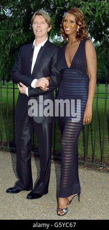 Model Iman and musician David Bowie arriving at the Vanity Fair Gala in