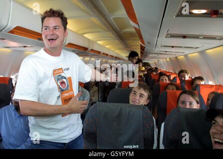 Wilkinson Sword Cutting Edge of Comedy finalist Phil Walker, on board an Easyjet flight from London Luton to Edinburgh as it became one of the highest comedy clubs in the country. *Walker, and the other finalist Jen Brister, performed routines on the plane and were then graded by passengers on the flight. Stock Photo