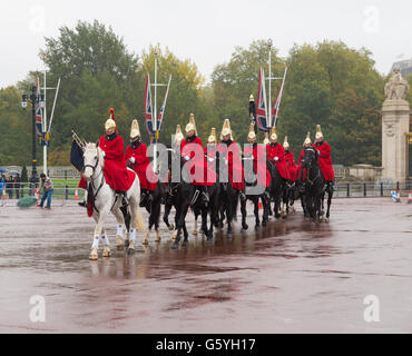 LONDON, ENGLAND - OCTOBER 21, 2015: Horse parade arrives at Buckingham palace, the London residence and administrative headqu Stock Photo