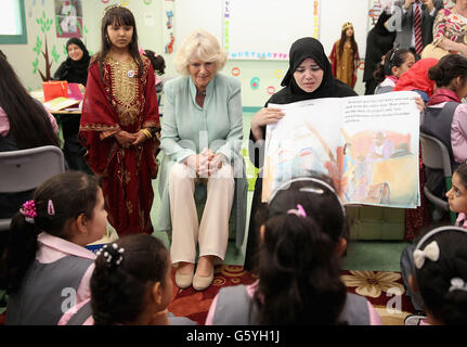 The Duchess of Cornwall talks with pupils as she visits the Amna Mahmoud Al Jeddah Primary Independant School for Girls on day four of the Royal tour to the Middle East in Doha, Qatar. Stock Photo