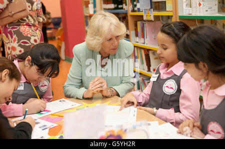 The Duchess of Cornwall talks with pupils as she visits the Amna Mahmoud Al Jeddah Primary Independant School for Girls on day four of the Royal tour to the Middle East in Doha, Qatar. Stock Photo