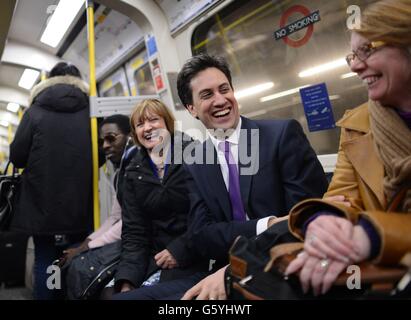 Labour leader Ed Miliband takes the tube back to Westminster after meeting shoppers, market stall holders and restaurants owners in Brixton, south London today. Stock Photo