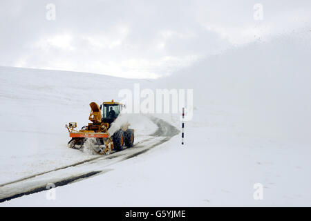 A snow blower clears the road on the way to Allenheads in Northumberland after more heavy snow hit the region. Stock Photo