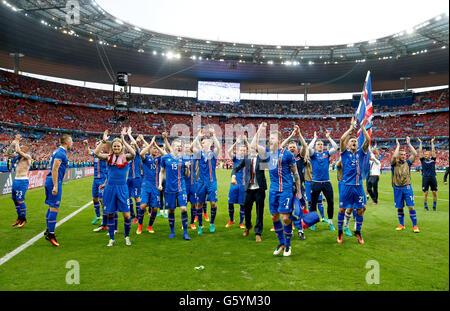 Iceland players celebrate their late winner and qualifying for the last 16 round after the Euro 2016, Group F match at the Stade de France, Paris. Stock Photo