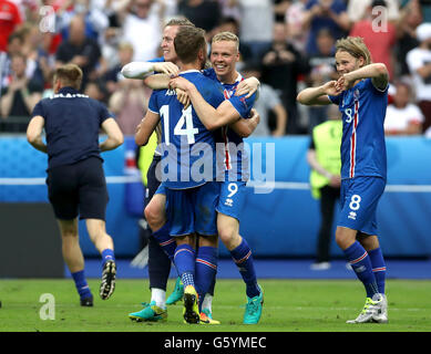 Iceland players celebrate their late winner and qualifying for the last 16 round after the Euro 2016, Group F match at the Stade de France, Paris. Stock Photo