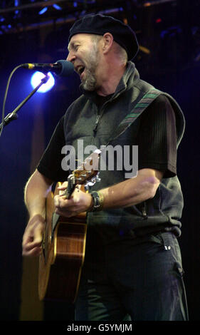 Former member of Fairport Convention, folk rock guitarist and singer songwriter Richard Thompson performing on stage at the Fairport Convention Cropredy 2002 Festival. Stock Photo