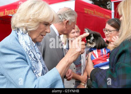 The Prince of Wales and the Duchess of Cornwall, known as the Duke and Duchess of Rothesay while in Scotland, at the Dumfries House Dog Show in the grounds of Dumfries House, Cumnock, Ayrshire. Stock Photo