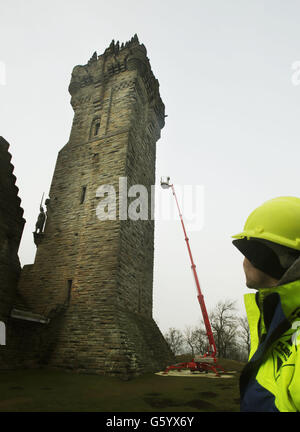 A stained glass window depicting William Wallace is returned to it's home at the Wallace Monument in Stirling following painstaking work to restore the century-old windows. Stock Photo