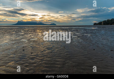 Calm, peaceful sunset view over the beach and South China Sea from Bako National Park, Sarawak, Borneo Stock Photo