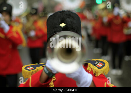 A Canadian marching band joins revellers during the St Patrick's day parade through Dublin city centre on St Patrick's day. Stock Photo