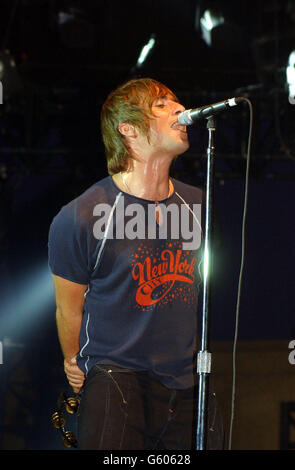 Liam Gallagher, of Oasis performing in concert at Roseland in New York City, USA. Some band members were injured in Indianapolis, Indiana, USA when their taxi crashed head on into another vehicle. * Noel Gallagher showed no signs of the shock, cuts or bruising he suffered in last Tuesday's accident. 01/10/02 Oasis have recorded perennial classic Merry Xmas Everybody for a charity album featuring top acts performing past chart-toppers it was revealed. The band have given their own twist to the love it or loathe it seasonal track for the CD 1 LOVE which will be released on October 14. Stock Photo